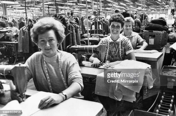 Machinist working mothers keep up production at the Steingberg and Sons gown factory at Hawthorn, Pontypridd as their children ware cared for at the...
