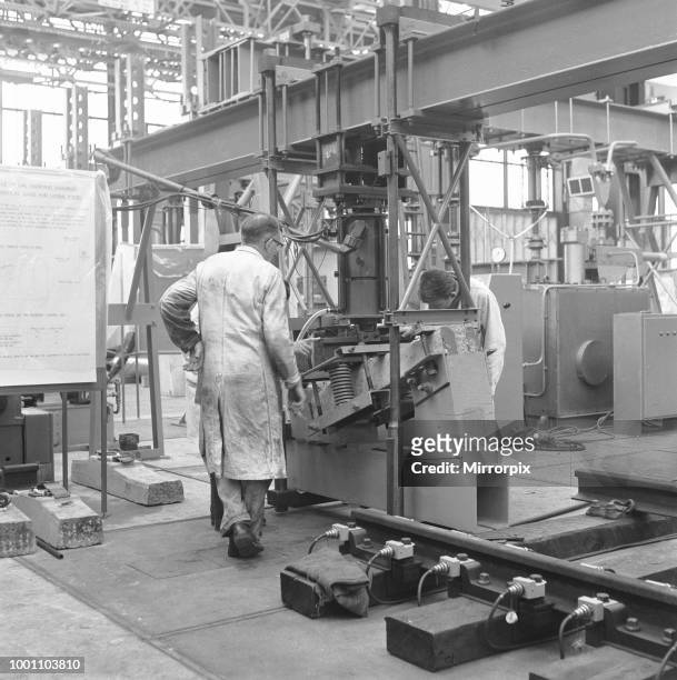Apprentice at the British Rail Research Laboratories electrically testing a rail fastening assembly, 18th May 1964.