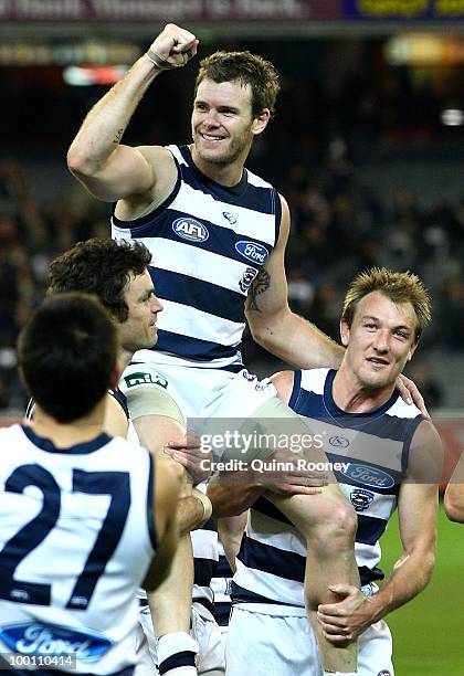 Cameron Mooney of the Cats is carried off the ground by team-mates after playing his 200th game during the round nine AFL match between the...