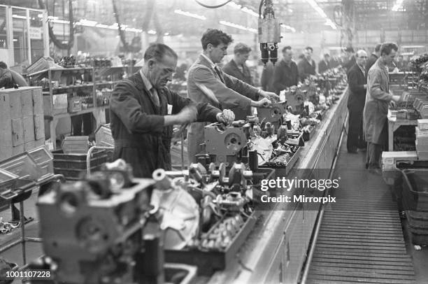 The transverse engine assembly line for the Mini. The Austin Mini production line at Longbridge, 10th March 1963 .