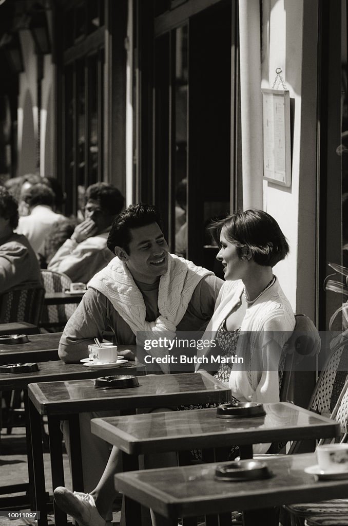 COUPLE AT OUTDOOR CAFE IN PARIS
