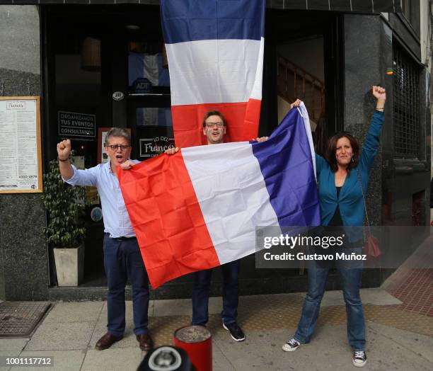 French supporters celebrate during the FIFA World Cup Russia final against Croatia at 'Lo del Frances' Bar on July 15, 2018 in Buenos Aires,...