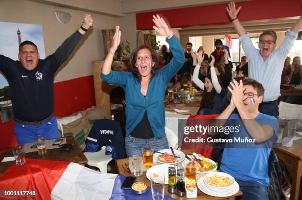 French supporters celebrate during the FIFA World Cup Russia final against Croatia at 'Lo del Frances' Bar on July 15, 2018 in Buenos Aires,...