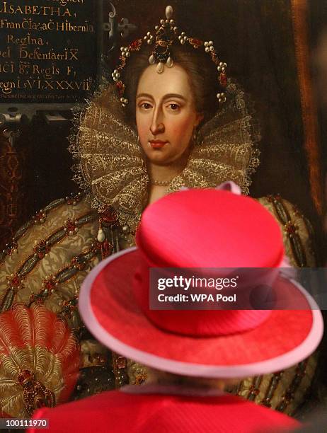 Britain's Queen Elizabeth II looks at a portrait of Queen Elizabeth I during a visit to Westminster Abbey and Westminster School, on the 450th...