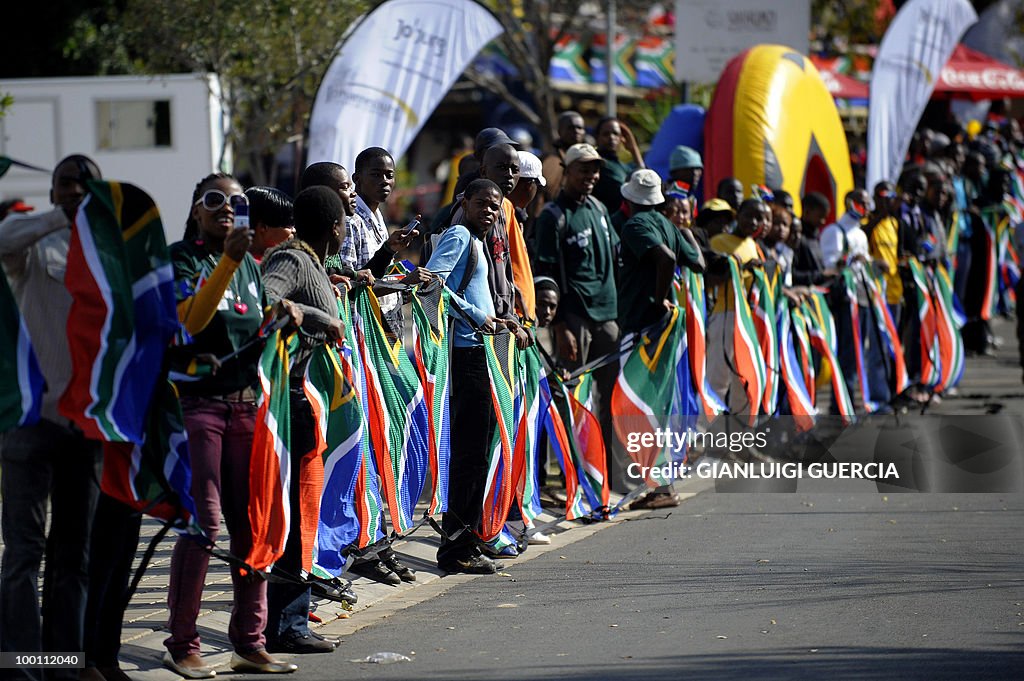 Residents from Soweto hold South African