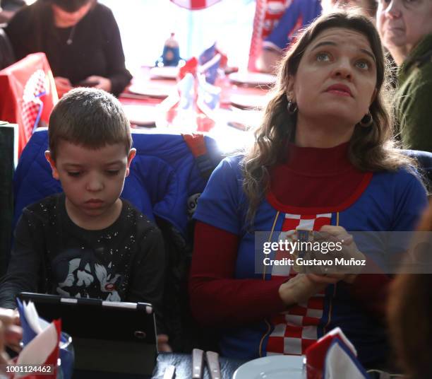 Croatian supporters look on during the FIFA World Cup Russia final against France at Dobar Tek Bar on July 15, 2018 in Buenos Aires, Argentina.