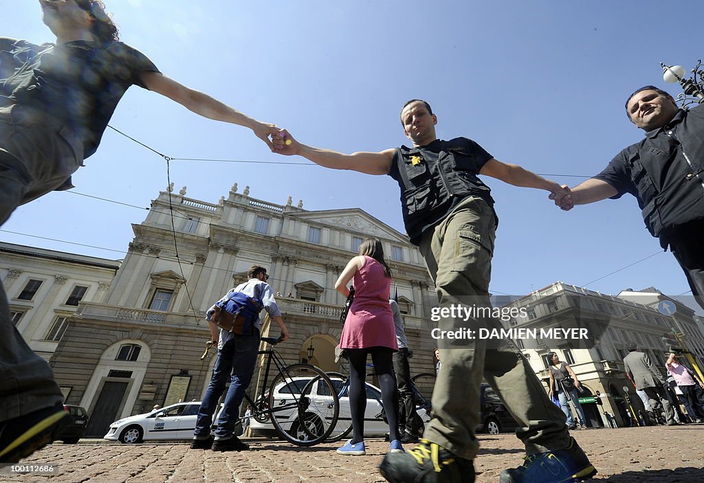 La Scala opera house workers form a circ