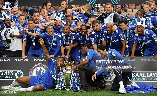 Chelsea players celebrate with the Barclays Premier League trophy after they win the title with a 8-0 victory over Wigan Athletic in the English...