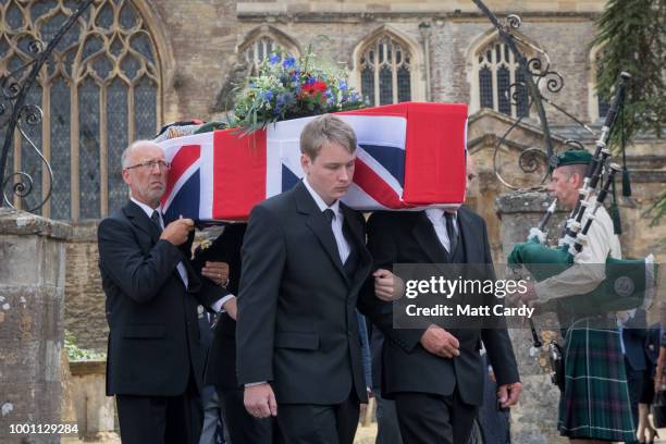 The coffin of World War 2 veteran Patrick Churchill is carried from St Mary The Virgin Church in Witney on July 18, 2018 in Oxfordshire, England....