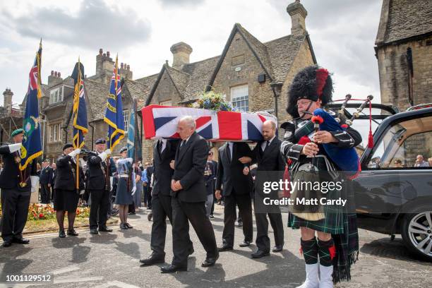 The coffin of World War 2 veteran Patrick Churchill is carried from St Mary The Virgin Church, to the War Memorial on Church Green in Witney on July...
