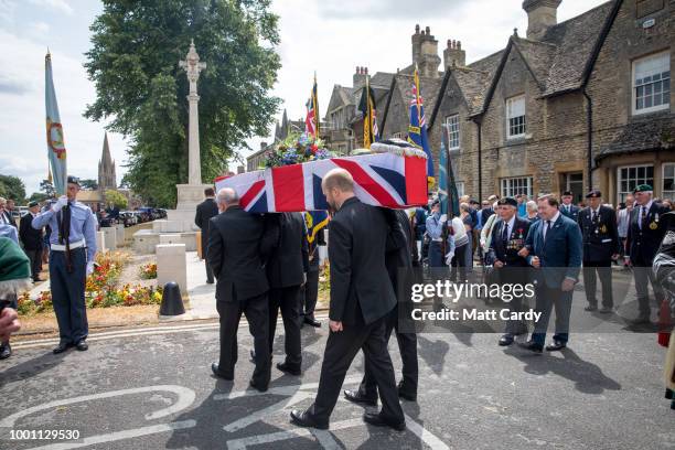 The coffin of World War 2 veteran Patrick Churchill is carried from St Mary The Virgin Church, to the War Memorial on Church Green in Witney on July...