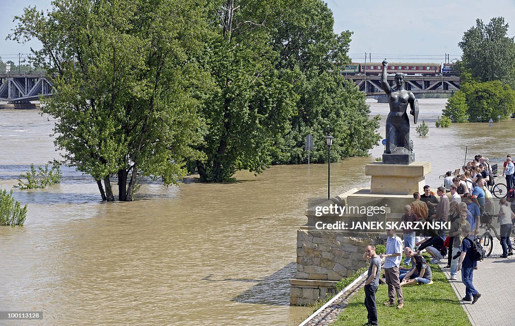 People watch the high water of the Wisla