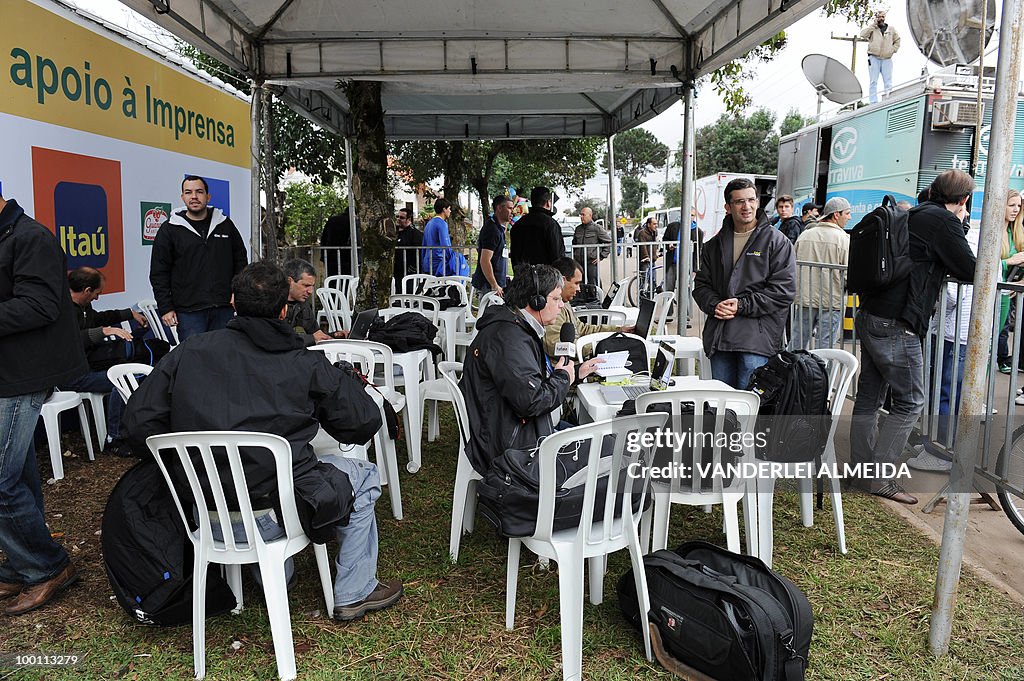 Journalists work in a tent located in fr