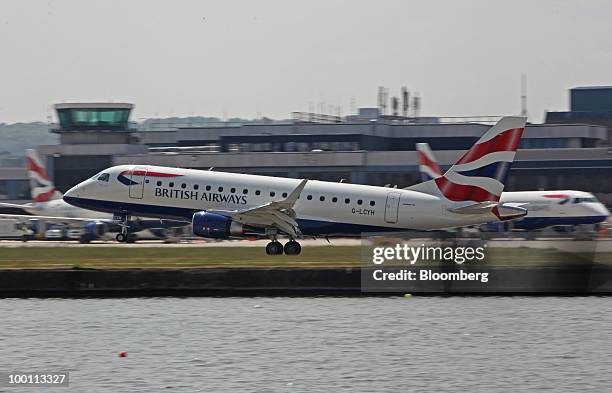 British Airways airplane comes into land at City Airport in London, U.K., on Friday, May 21, 2010. British Airways Plc said it will break even this...