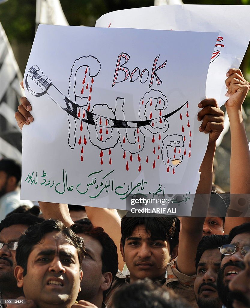 A Pakistani demonstrator holds up a plac