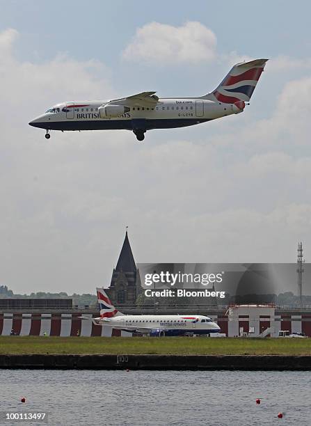 British Airways airplane comes into land at City Airport in London, U.K., on Friday, May 21, 2010. British Airways Plc said it will break even this...
