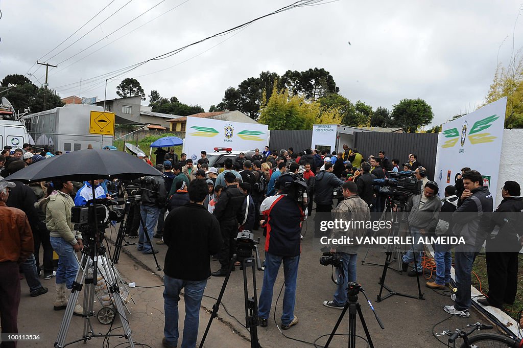 Journalists wait in front of the trainin