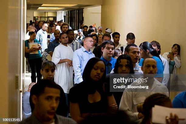 People wait in line at a job fair for SmartCo Foods in Denver, Colorado, U.S., on Thursday, May 20, 2010. SmartCo Foods, a division of...