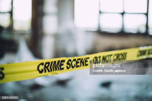 cordon tape on a crime scene - violence stock pictures, royalty-free photos & images