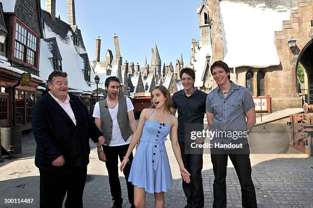 In this handout photo provided by Universal Orlando, Harry Potter film stars Robbie Coltrane, Matthew Lewis, Emma Watson, Oliver Phelps and James...