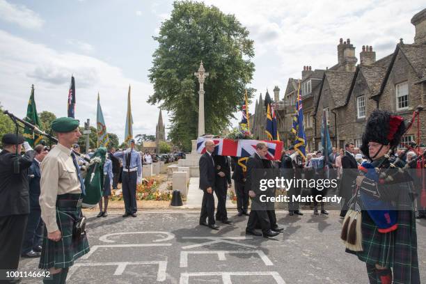 The coffin of World War 2 veteran Patrick Churchill in carried from the War Memorial on Church Green following a service in Witney on July 18, 2018...