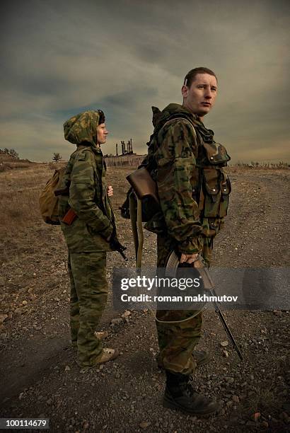 two military men on watch - military rucksack stock pictures, royalty-free photos & images