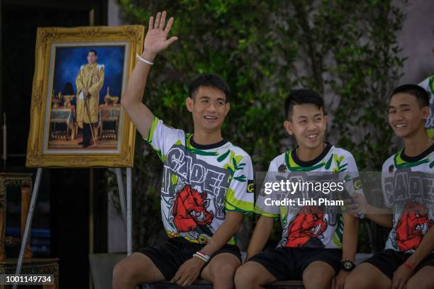 Twelve boys and their coach, Ekkapol Chantawong , from the 'Wild Boars' soccer team speak during a press conference for the first time since they...