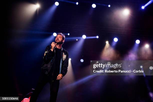 Tom Meighan and his group Kasabian performs on stage on July 15, 2018 in Naples, Italy.