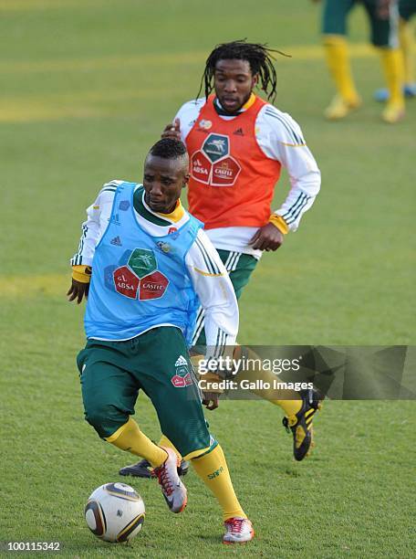 Teko Modise and Macbeth Sibay of South Africa in action during the Bafana Bafana training session at Marks Park Grounds on May 21, 2010 in...