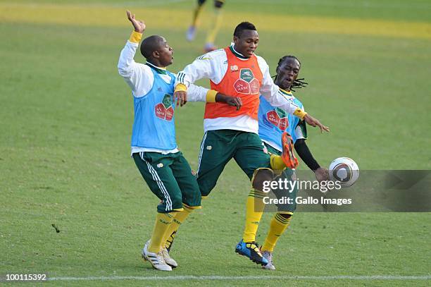 Tsepo Masilela, Kagisho Dikgacoi and Reneilwe Letsholoyane of South Africa in action during the Bafana Bafana training session at Marks Park Grounds...