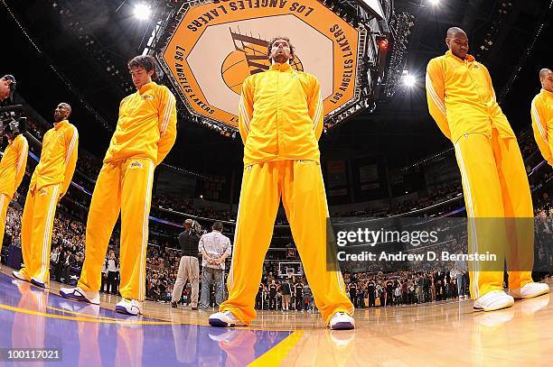 Sasha Vujacic, Pau Gasol and Andrew Bynum of the Los Angeles Lakers stand for the national anthem before the game against the Phoenix Suns in Game...