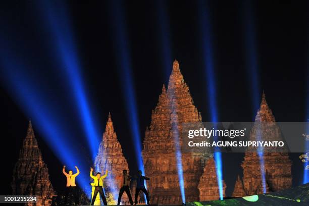 Indonesian dancers perform the Korean "Gangnam Style" dance during a ceremony at the Prambanan temple in Yogyakarta on July 18, 2018. - Indonesia...