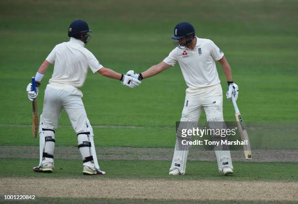 Dawid Malan of England Lions is congratulated by Ollie Pope after reaching his 50 during Day Three of the Tour Match between England Lions and India...