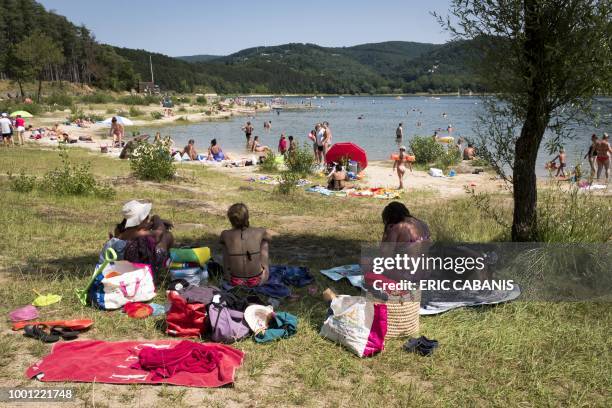 People are relaxing on July 18 on the shores of Lake St Ferreol Revel, one of the water tanks of the Canal du Midi.