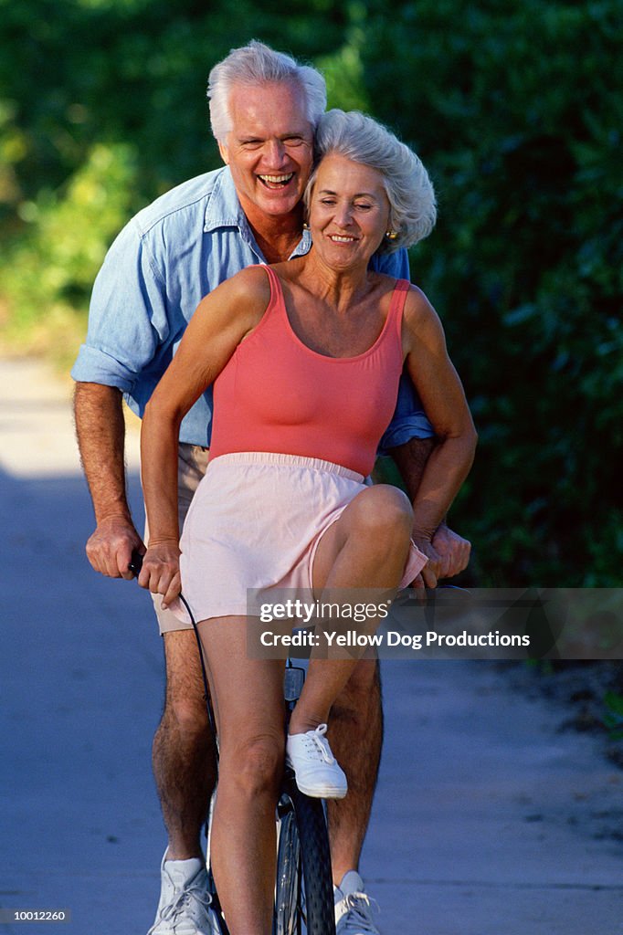 MATURE COUPLE ON BICYCLE