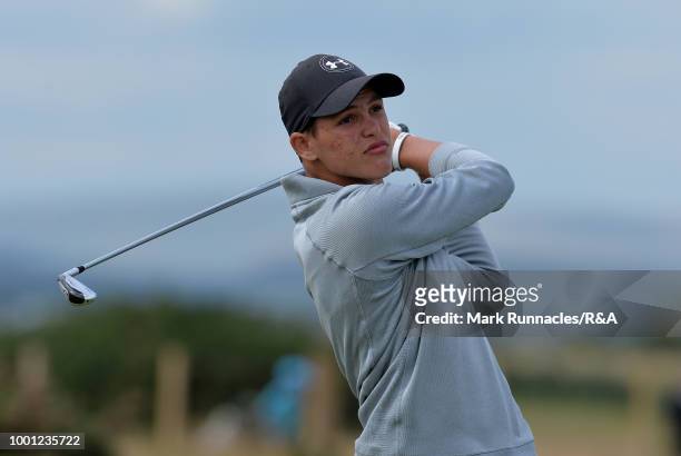 Aaron Jarvis of Cayman Islands plays his tee shot at the 18th tee during the final day of the The Junior Open Championship at Eden Golf Course on...