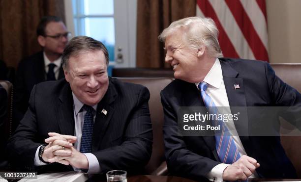 Secretary of State Mike Pompeo and President Trump share a laugh during a cabinet meeting with U.S. President Donald Trump in the Cabinet Room of the...