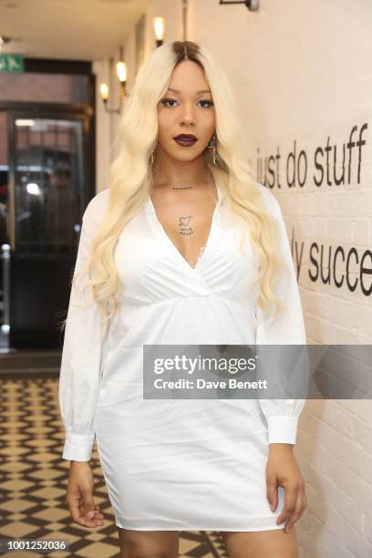 Munroe Bergdorf attends Thomas Webb's debut art exhibition, STRANGERS on July 18, 2018 in London, England.