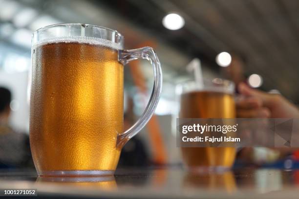 two big glasses of tea - lager stock pictures, royalty-free photos & images