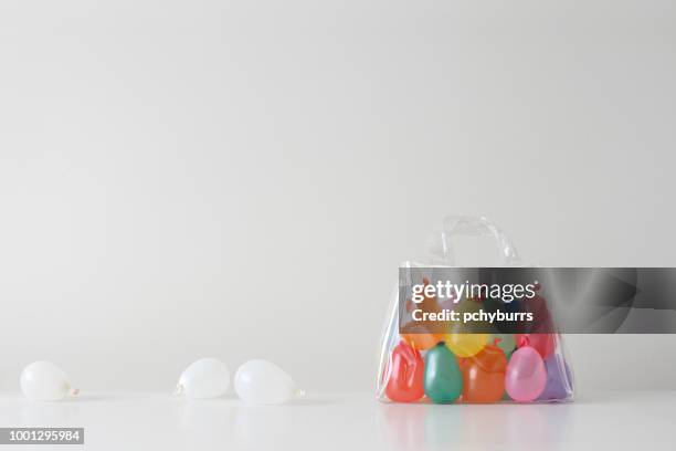 water balloons in a transparent plastic bag - transparent bag stock pictures, royalty-free photos & images