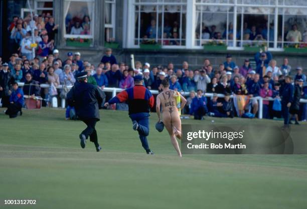 View of male streaker being chased naked across course during tournament at Old Course. St. Andrews, Scotland 7/20/1995 -- 7/23/1995 CREDIT: Bob...