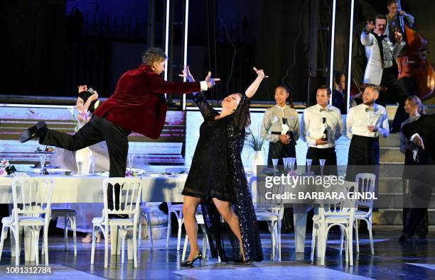 Austrian actress Stefanie Reinsperger as 'Buhlschaft' and Austrian actor Tobias Moretti as 'Jedermann' perform on stage during a rehearsal of Hugo...