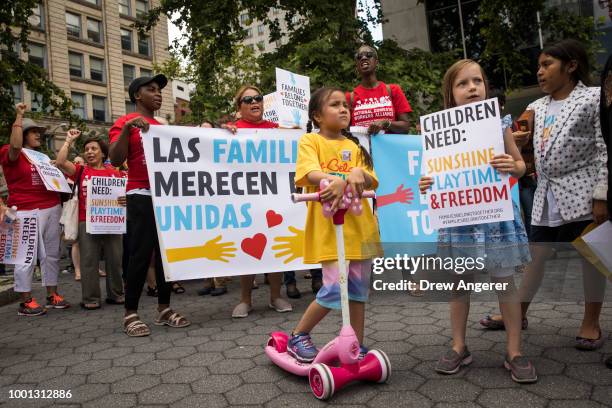 Activists, including childcare providers, parents and their children, protest against the Trump administrations recent family detention and...