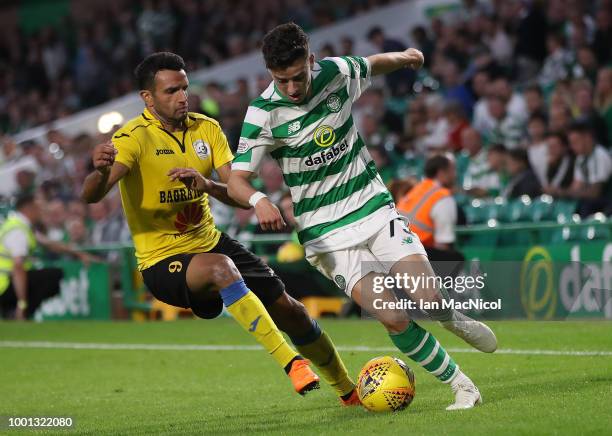 Artak Dashyan of Alashkert vies with Mikey Johnston of Celtic during the UEFA Champions League Qualifier between Celtic and Alashkert FC at Celtic...