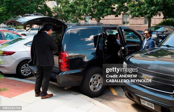 Marshals check their truck as they wait outside the US District Courthouse in Washington, DC on July 18, 2018. - Maria Butina was scheduled to appear...