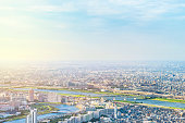panoramic modern city urban skyline bird eye aerial view under sun & blue sky in Tokyo, Japan