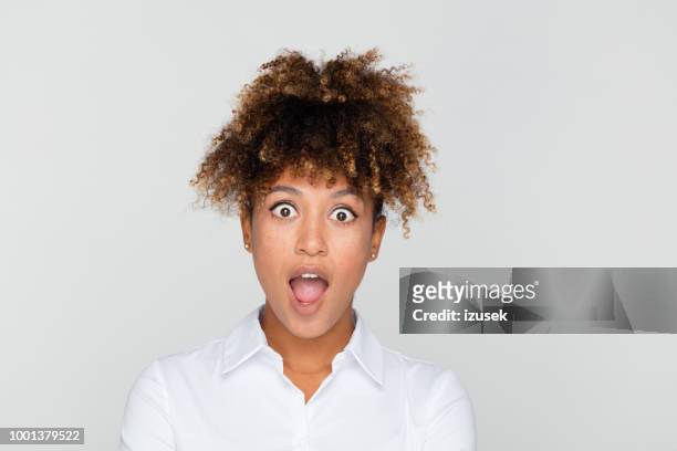 portrait of excited afro american businesswoman - curly hair woman white shirt stock pictures, royalty-free photos & images
