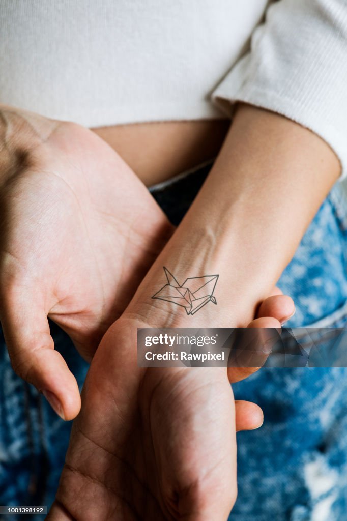 Close up of tattoo on the wrist of a woman