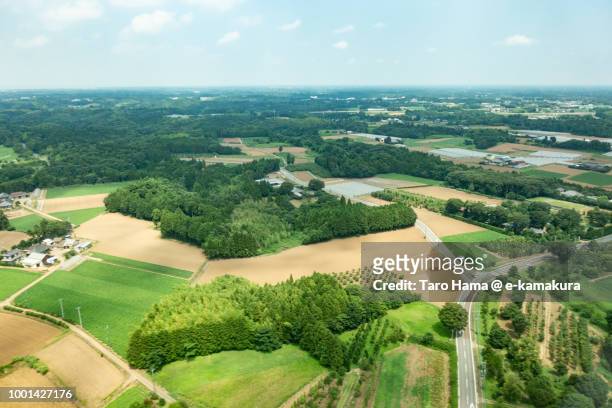 fields in narita city in ibaraki prefecture and kawauchi town in japan daytime aerial view from airplane - narita city stock pictures, royalty-free photos & images
