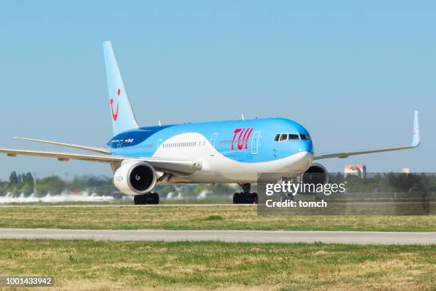 an airplane of the arline company tui taxiing at the boryspil airport, ukraine - tui ag stock pictures, royalty-free photos & images